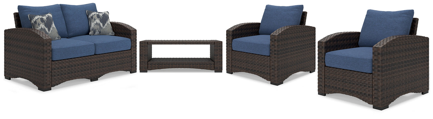 Loveseat de exterior Windglow y dos sillas con mesa de centro