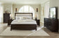 Neymorton Queen Upholstered Panel Bed with Mirrored Dresser and Nightstand