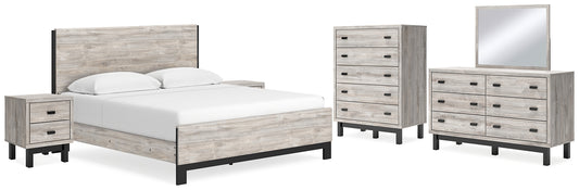 Cama Vessalli King con paneles, tocador con espejo, cómoda y dos mesitas de noche