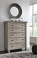 Harrastone California King Panel Bed with Mirrored Dresser and Chest